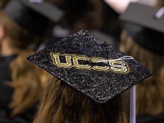 Graduation cap with UCCS on the top