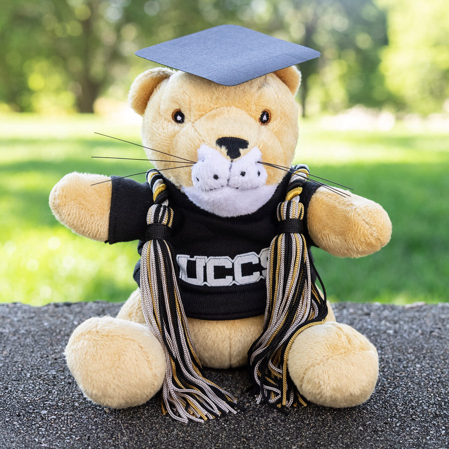 plush clyde wearing black and gold legacy cords