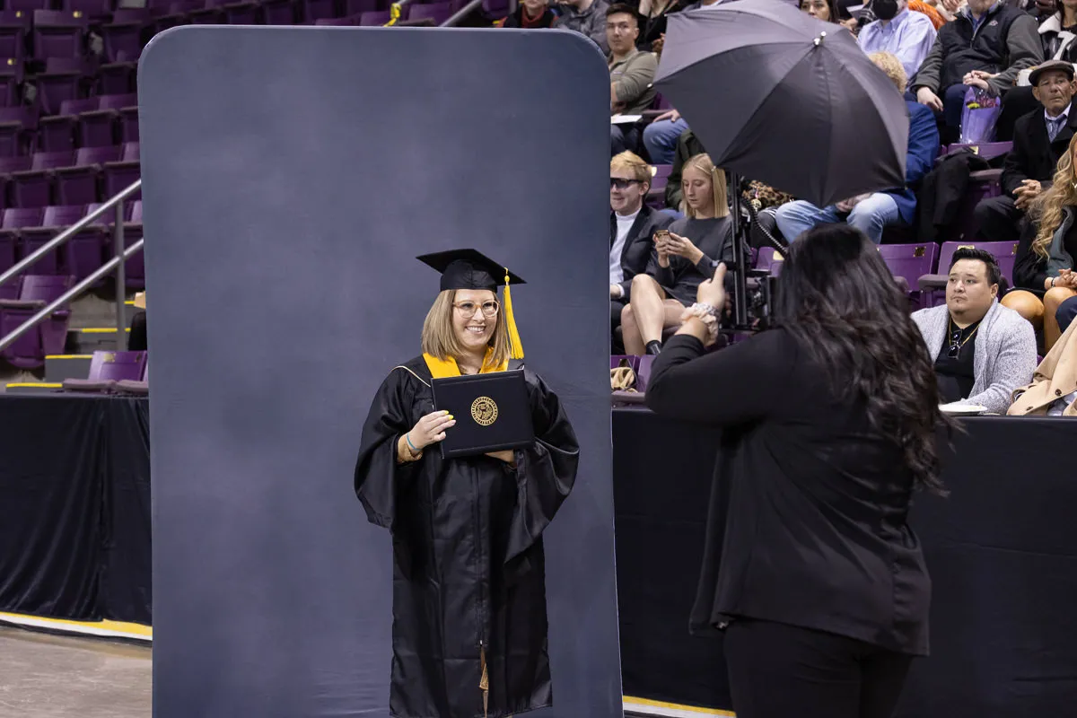 Following commencement, GradImages photographers circulated outside the commencement venue to capture additional candid photographs of our graduates with their loved ones. The GradImages staff wore black suits.