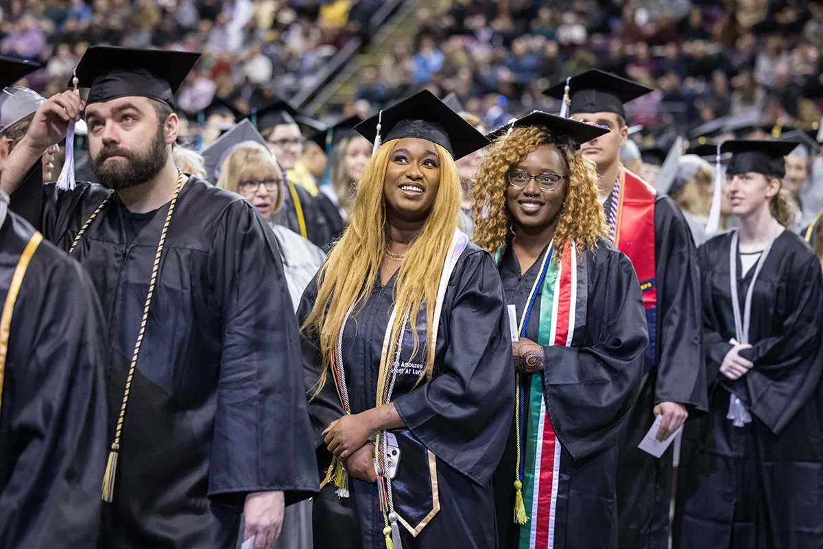 Students at Commecement with tassels.