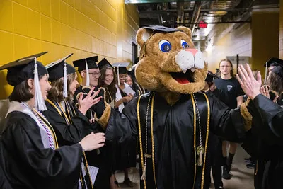 Clyde celebrating graduation 