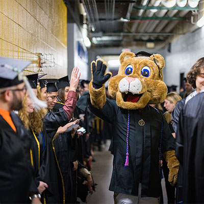 Clyde the mascot giving a high five